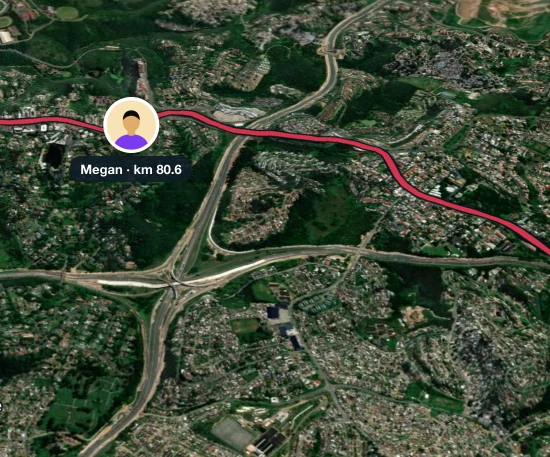 Megan's photo on RunFast's live map at km 80.6, on a course coloured red for hard heat, through the suburbs above Durban
