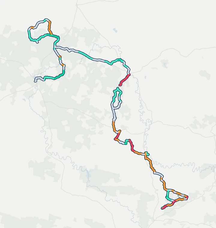 Map of the 2026 Nedbank Gravel Burn route, Graaff-Reinet to Shamwari over seven stages, each stretch coloured by how often the wind was a headwind or a tailwind there in 10 years of race weeks.