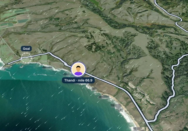 Windline’s live map on satellite: Thandi’s pin on the coast road, with the wind drifting across.